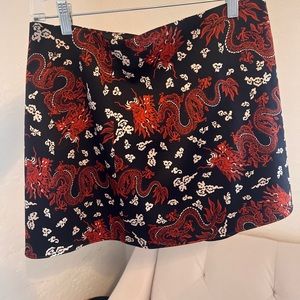 Zara mini skirt with dragon print, silky material, black, orange & cream colored